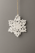Gehäkelte Schneeflocke aus Handarbeit – Winterlicher Baumschmuck
